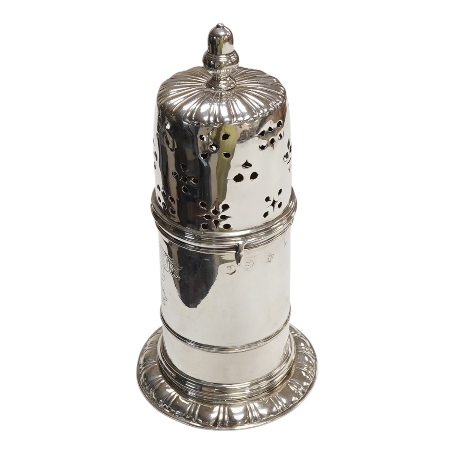 An early 18th century silver lighthouse sugar caster, with later engraved armorial, marks rubbed, London, post 1720, (repaired), height 18.2cm, 10.8oz.